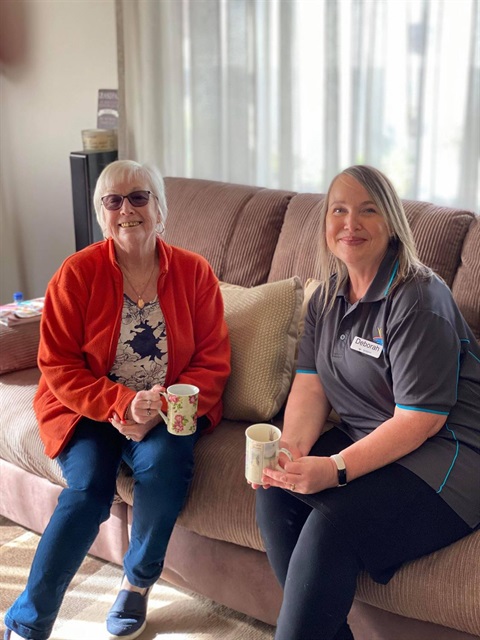 Community Support Worker and client having cup of tea